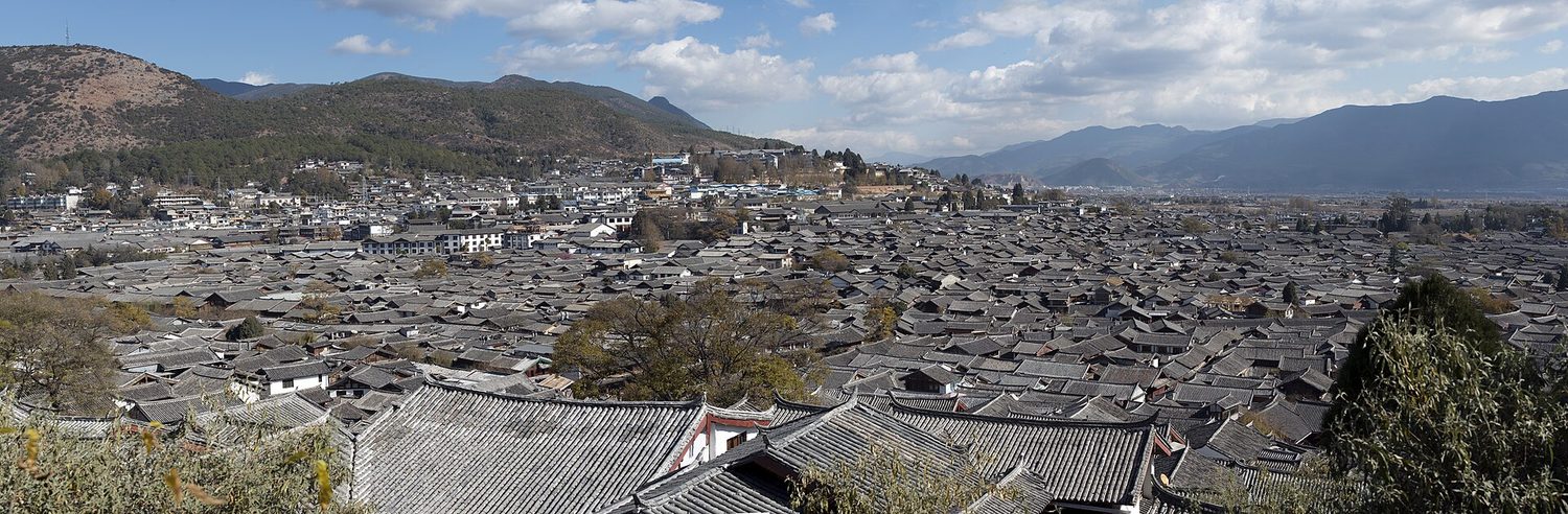 Tiled rooftops packed together in the old town of Lijiang