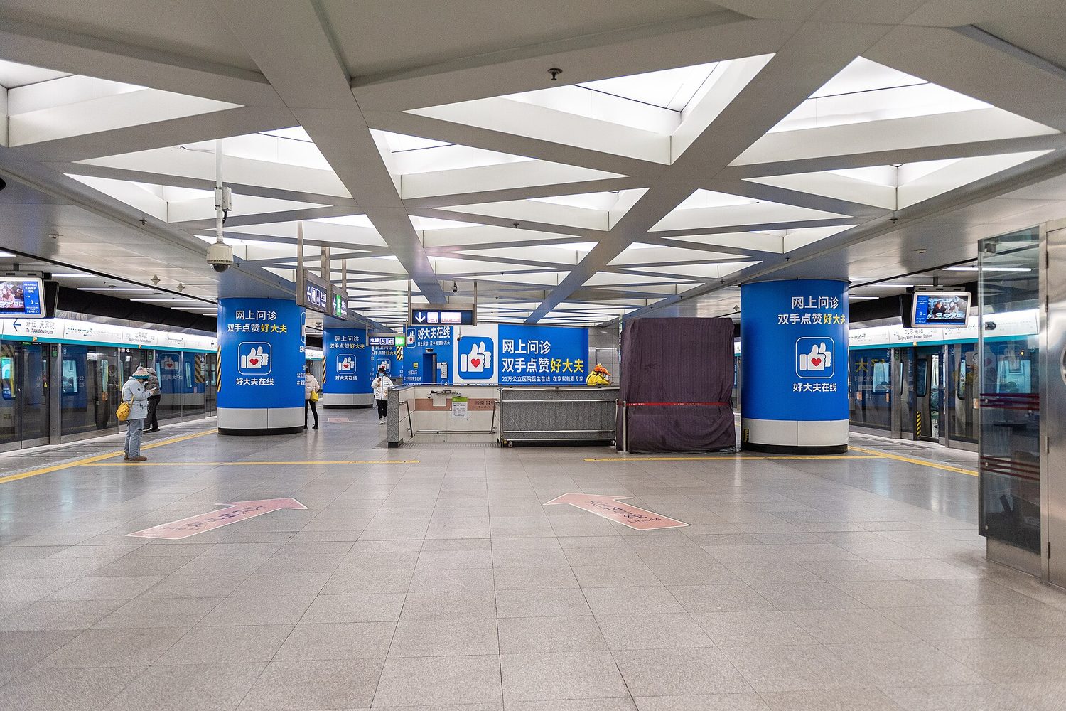 Departure boards inside a large Chinese railway station